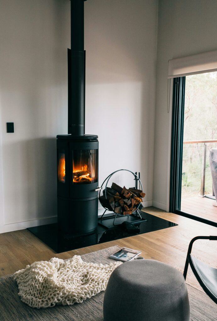 A cozy modern living room with a stylish fireplace and wood accents.
